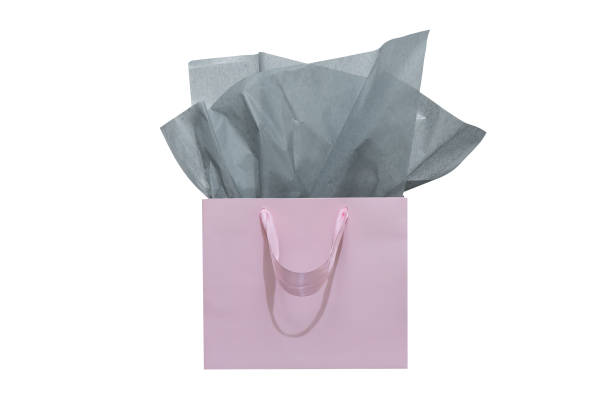 istock Craft paper gift bag with tissue paper isolated on a white background 1482180444