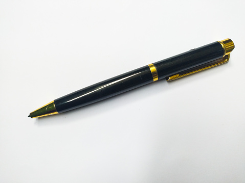 Close-Up High Angle View Of Pen Over White Background