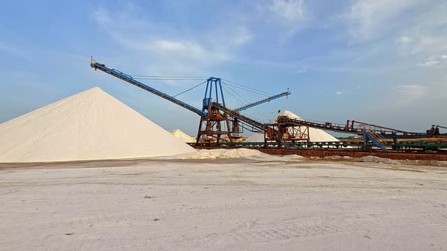 Salinas in Torrevieja, view of machines extracting sea salt from evaporated water.