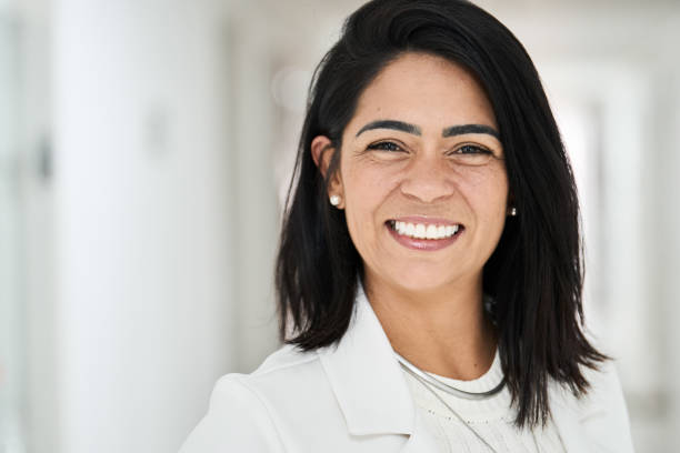 istock Businesswoman smiling while standing in the corridor 1482186299