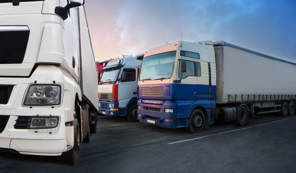istock Trucks in a row in the parking lot 1482187539