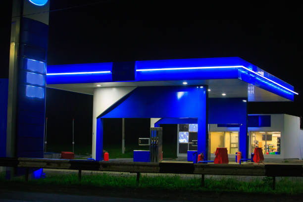 istock Illuminated gas station at night. Isolated 1482187725