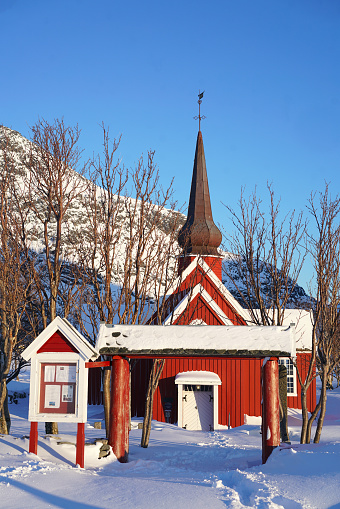 A red wooden Flakstad church from1760 near the beach on Flakstadøya island in Lofoten archipelago, Nordland, Norway.