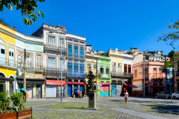Rio de Janeiro, Brazil - April 4, 2023: Pedra do Sal district. The beautiful architecture of traditional buildings painted in pastel colors. Incidental people.