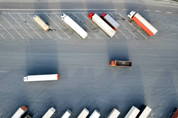 istock Trucks on a parking lot. Rest Area on a highway road 1482194947