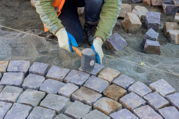 istock The worker were using industrial cobblestones to pave the sidewalk with granite stones. 1482195031