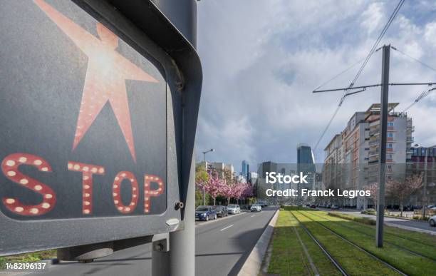 Courbevoie France 04 12 2023 View Of La Defense District From The The Tramway Track And A Red Stop Sign Stock Photo - Download Image Now