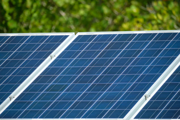 istock Solar photovoltaic panels mounted on stand-alone frame on backyard ground for generating of clean ecological electric energy. Concept of autonomous house 1482196299