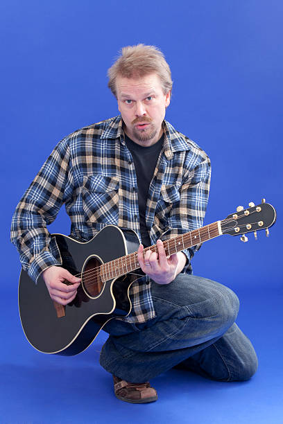 istock Portrait Of A Man With Guitar 148219731