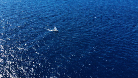 The Joy of Travel: A Beautiful Yacht Sailing Freely in the Open Sea