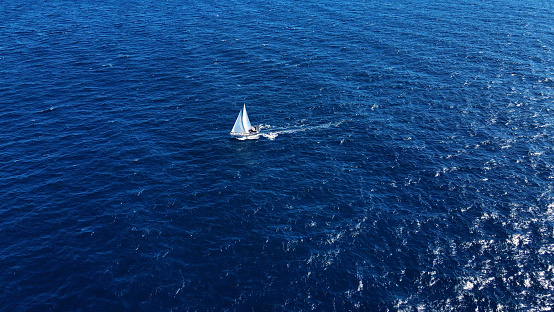 The Joy of Travel: A Beautiful Yacht Sailing Freely in the Open Sea