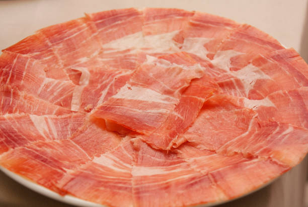 Sliced salami and ham arrayed for a savory selection