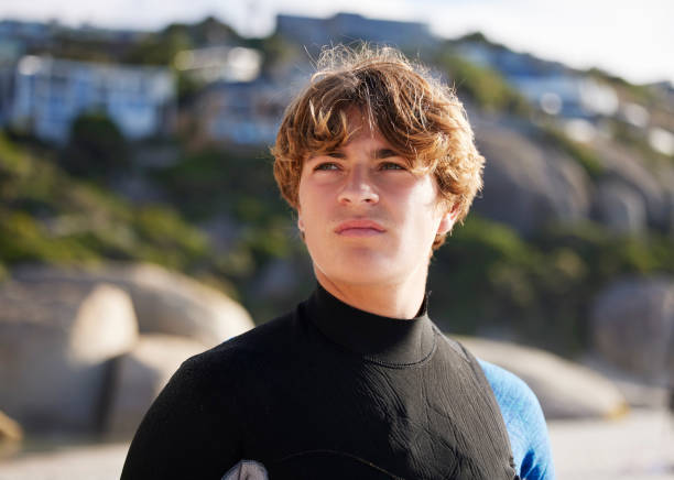 istock Surfer, man and thinking on beach, vacation and ideas for competition, training and on weekend break. Male, guy and athlete in swimsuit, seaside holiday and practice for sport, hobby and summer trip 1482200975