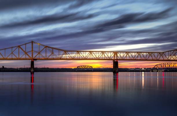 istock the bridge over water and a sunset in the background with clouds 1482201063