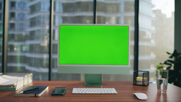 istock Computer monitor mockup placed desk closeup. Green screen pc modern workplace 1482205603
