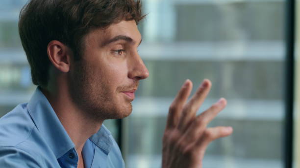 istock Smiling manager greeting video conference closeup. Businessman talking clients 1482205670