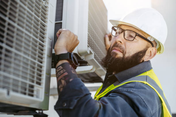 istock The engineer checks the functionality of the air conditioner 1482207361