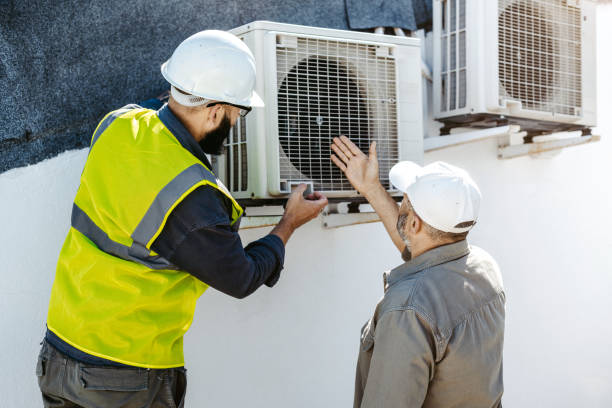 istock The engineer and client check the functionality of the air conditioner 1482207425