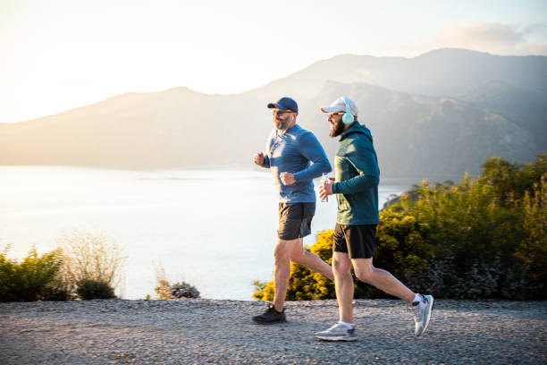 istock Two man enjoy jogging in mountains at sunset 1482207542