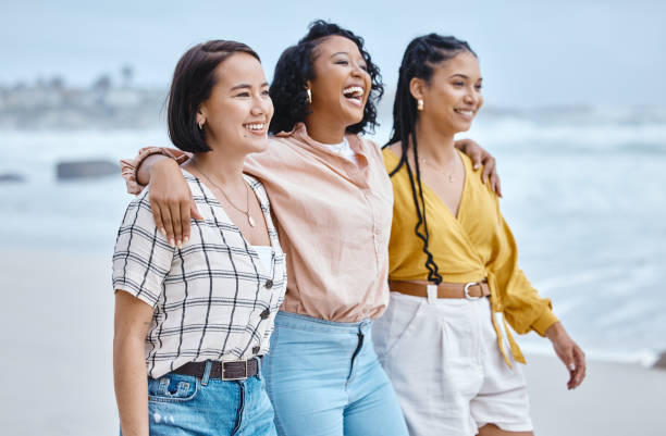 istock Beach, diversity and friends, hug and walk while laughing, relax and talking against nature background. Travel, women and group embrace while walking at the sea, happy and smile on ocean trip in Bali 1482208076