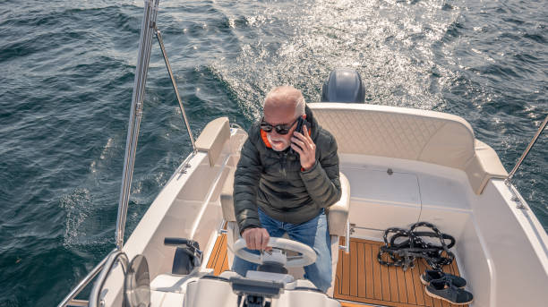 istock Mature man piloting boat 1482213651