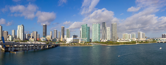 USA, Miami harbor panoramic skyline from cruise ship departing to Caribbean vacation.