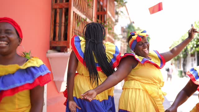 Palenqueras dancing on the street in Cartagena, Colombia