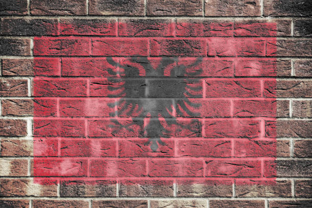 istock Albania flag on a brick wall background 1482220114