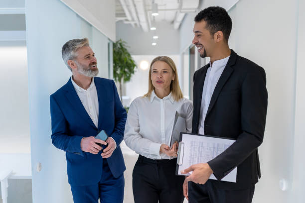 istock Colleagues talking after business meeting and looking involved 1482220958