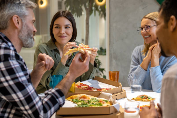 istock Friends having good time during lunch and enjoying pizza 1482221030