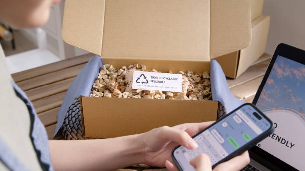 istock Go green SME owner reply chat comment online talk or set up chatbot on phone. Young seller asia woman typing mobile at home office easy selling CRM platform for eco friendly shop retail net zero store 1482221285