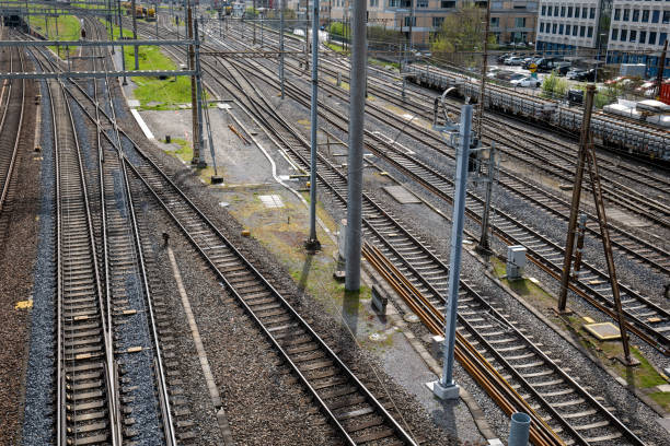 istock Several empty parallel train tracks in major rail hub in European city. Above view, trains, no people 1482222645
