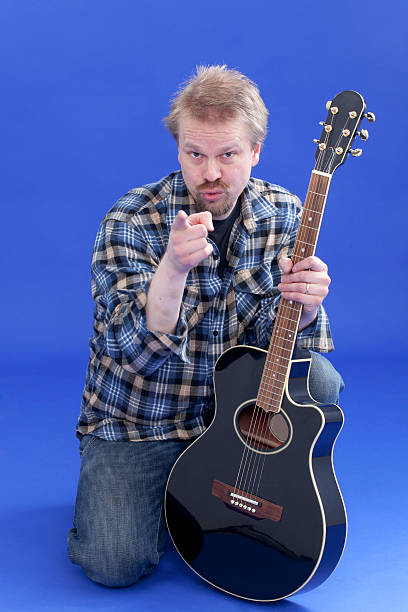 istock Portrait Of A Man With Guitar 148222311