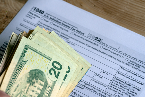 IRS form 1040 and dollars still life background.
