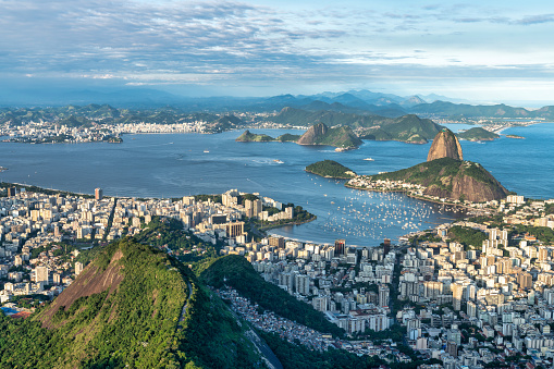 This photo showcases the awe-inspiring skyline of Rio de Janeiro, Brazil. The cityscape is a magnificent display of architectural and natural wonders. The photo captures the bustling metropolis with its vibrant streets, colorful buildings, and modern infrastructure, making it an ideal choice for travel brochures, websites, or any project that aims to highlight the beauty and wonder of this incredible city.