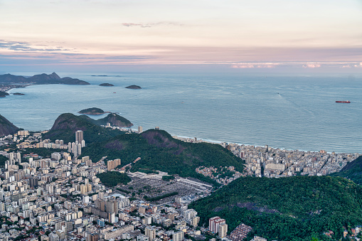 This photo showcases the awe-inspiring skyline of Rio de Janeiro, Brazil. The cityscape is a magnificent display of architectural and natural wonders. The photo captures the bustling metropolis with its vibrant streets, colorful buildings, and modern infrastructure, making it an ideal choice for travel brochures, websites, or any project that aims to highlight the beauty and wonder of this incredible city.