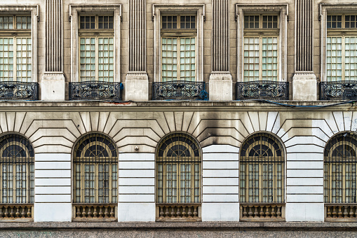 This photo captures the beauty and grandeur found in a building's facade.  This photo is perfect for use in marketing materials, brochures, websites, and other projects that require images that celebrate architectural beauty and excellence.