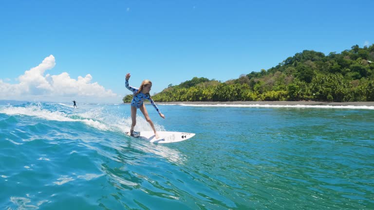 Young Girl Surfing in Costa Rica