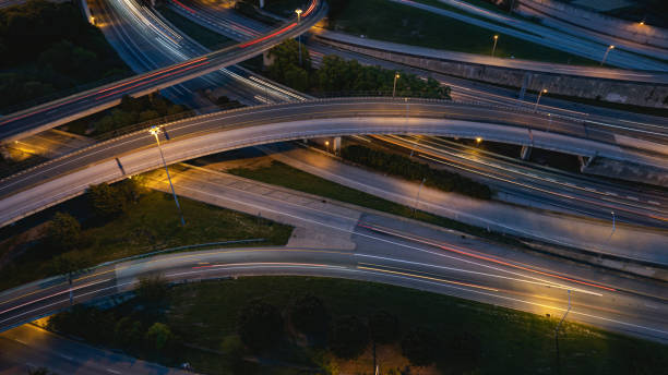 istock light streaks zooming over the highway intersection 1482237869