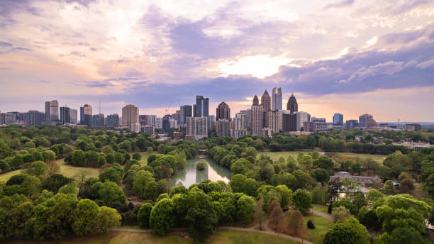 iconic view of Atlanta skyline over Piedmont Park iconic view of Atlanta skyline over Piedmont Park atlanta skyline stock pictures, royalty-free photos & images