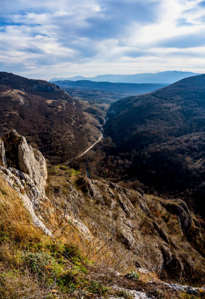 istock Autumn mountain view with old railway with its tunnels and a river passing through the canyon,Southern Serbia. 1482240053