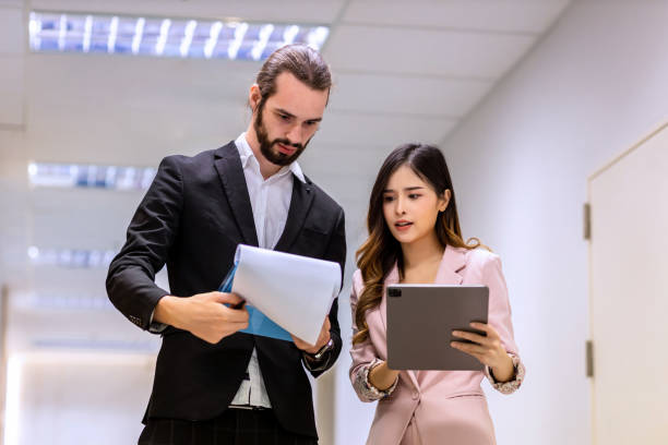 istock Diverse friend  partners colleagues talking walking in modern office hallway. 1482241922