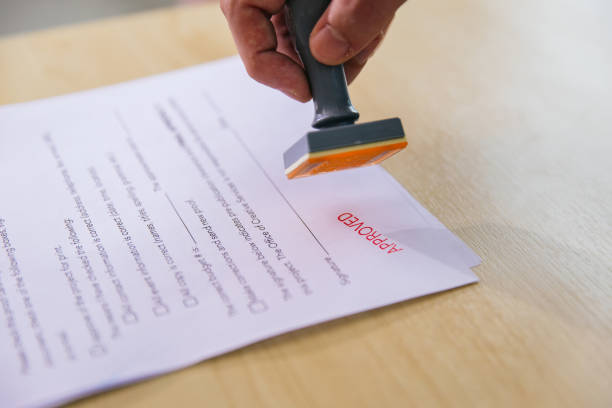 istock Business Man Stamping With Approved Stamp On Document. 1482242098