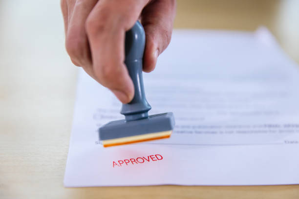istock Business Man Stamping With Approved Stamp On Document. 1482242631