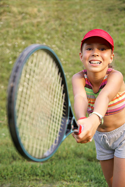 istock Cheerful girl playing tennis 148224664