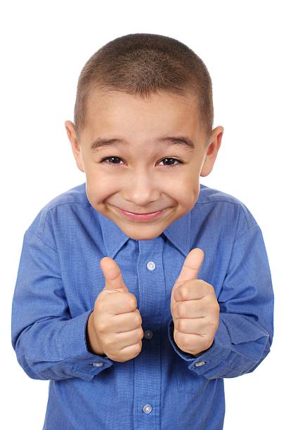 kid smiling giving thumbs up six year old boy smiling giving thumbs up sign, isolated on white background crew cut stock pictures, royalty-free photos & images