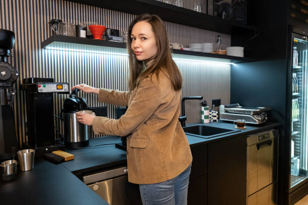 istock Calm young barista preparing a beverage in a cafe 1482248550