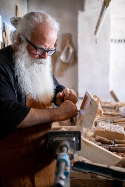 istock Senior male carpenter working 1482251217
