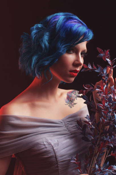 istock Girl with blue dyed hair in studio on black background 1482253621