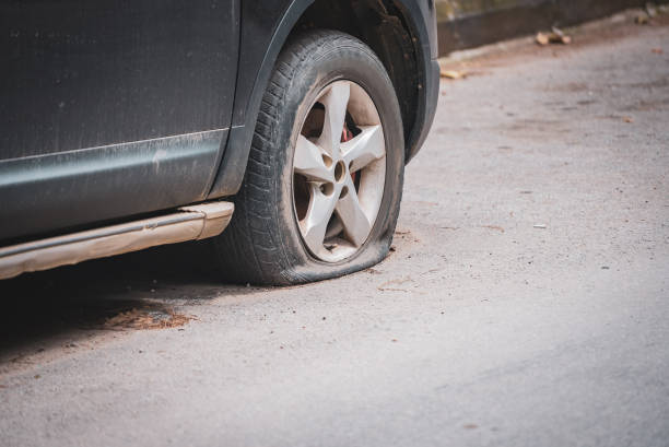 istock Old car or small van has a flat tire 1482253737